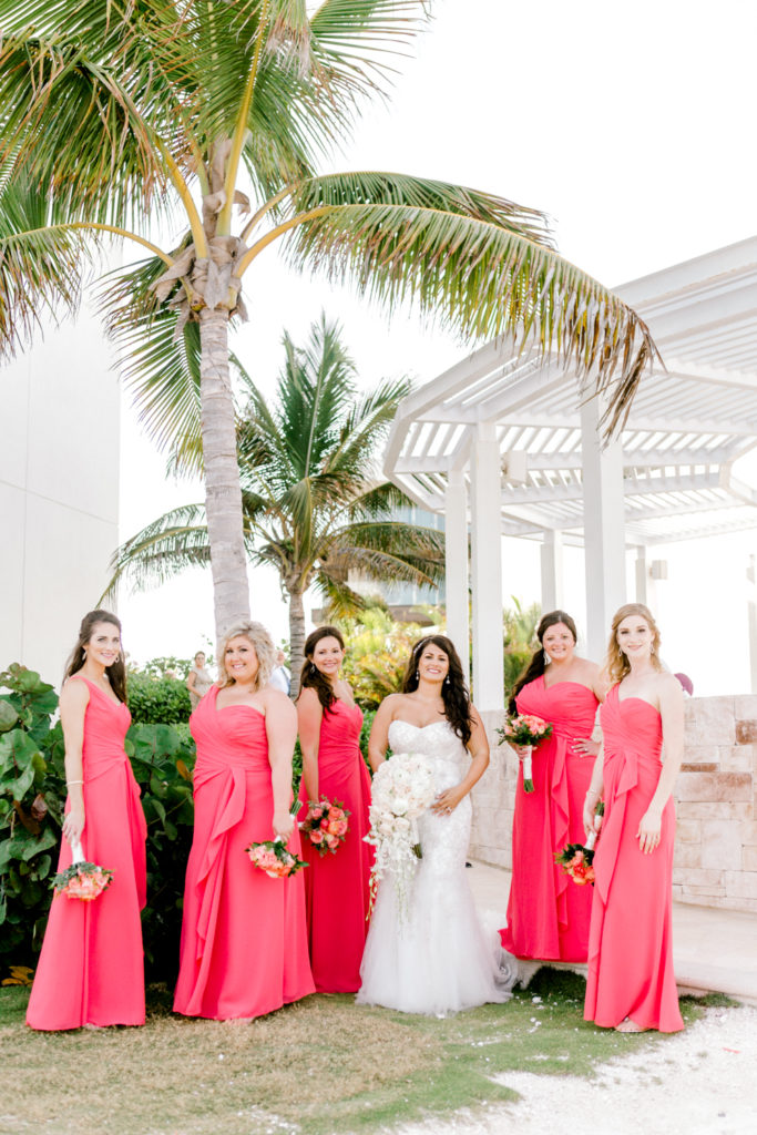 Bridesmaids under palm tree