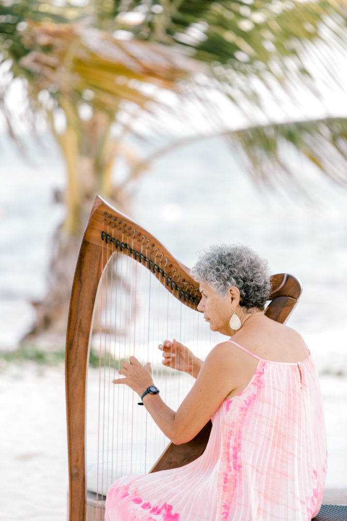 Harp player at Breathless Riviera